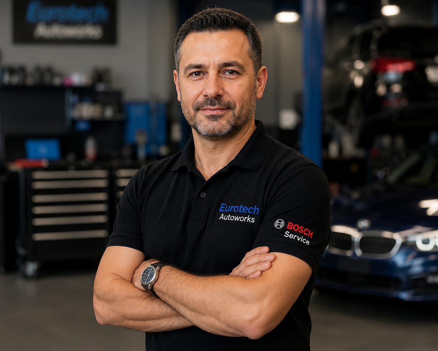 Mechanic standing in Eurotech Autoworks garage