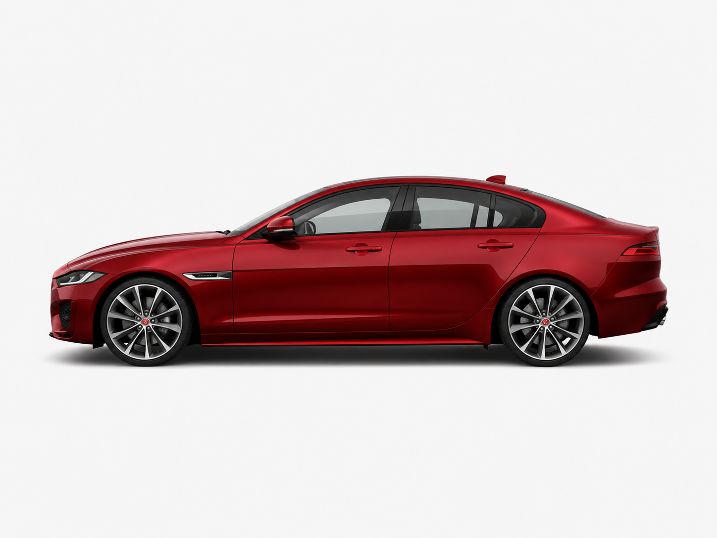 Red Jaguar sedan side profile view